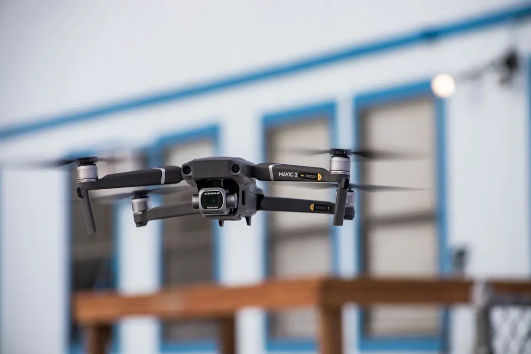 black and gray drone in mid air